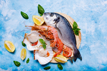 Food background with sea fish on blue. / Photodune, Misc
