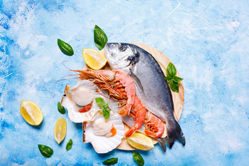 Food background with sea fish on blue. / Photodune, Misc