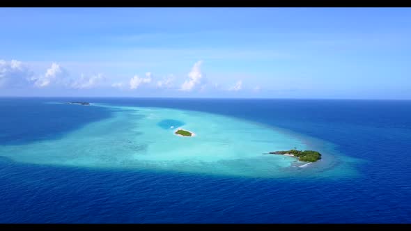 Aerial above scenery of beautiful coastline beach trip by blue green ocean with white sand backgroun