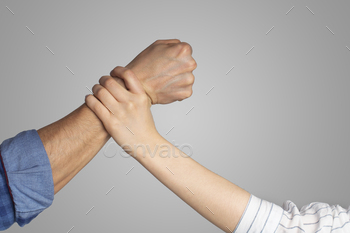 Social problems and protection of women. Male strong fist about to punch lady, woman stops man hand / Photodune, Misc