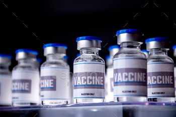 Glass vials for vaccine in laboratory. Group of vaccine bottles. Medicine in ampoules. / Photodune, Misc