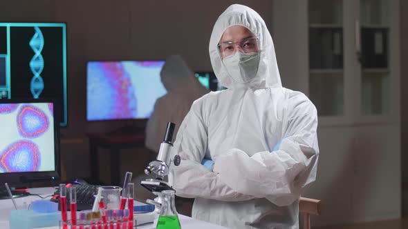 Asian Doctor Pose In A Modern Laboratory. Genetic Engineers Workplace