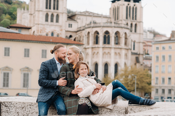 A beautiful family with strolls through the old city of Lyon in France.Family trip to the old cities / Photodune, Misc