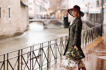 A girl in a hat in rainy weather in the old town of Annecy. France.A woman's walk around the / Photodune, Misc