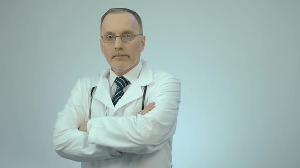 Successful Confident Doctor Looking at Camera With Folded Arms, Clinic Services