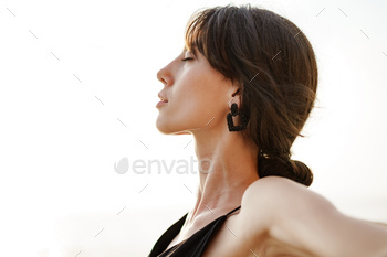 Young smiling woman outdoors portrait at beach / Photodune, Misc