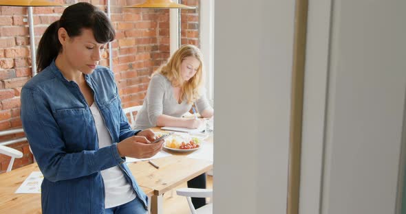 Businesswoman using mobile phone 4k