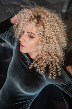 Close-up portrait Fashion young woman in black bodysuit with afro curls hairstyle / Photodune, Misc