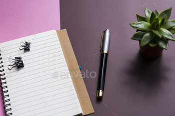 Notepad, pen and plants office desk, shadow / Photodune, Misc