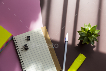 Notepad, pen and plants office desk, shadow / Photodune, Misc