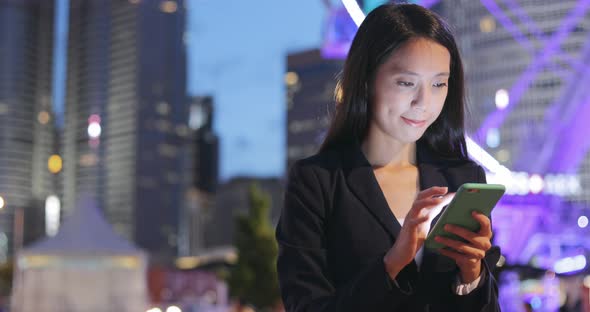 Business woman using tablet at outdoor street 