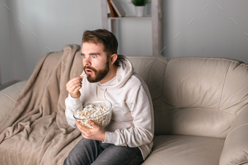 Portrait of guy watching TV series online. Online cinema and video streaming service concept / Photodune, Misc