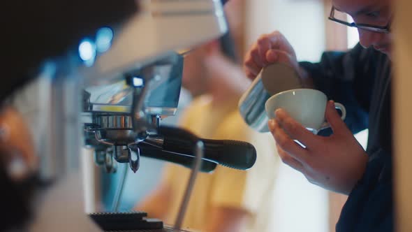 Barista Prepares Coffee in a Cafe