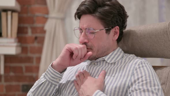 Portrait of Middle Aged Man Coughing, Feeling Unwell