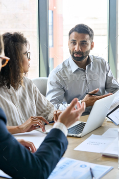 Diverse business executive team having discussion at boardroom meeting. / Photodune, Misc