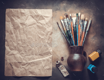 Paint brush and ainter tool on abstract background texture. Paintbrush painting and piece of paper / Photodune, Misc