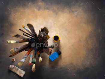 Paint brush in clay jug and art painter tool on abstract background texture. Paintbrush painting / Photodune, Misc
