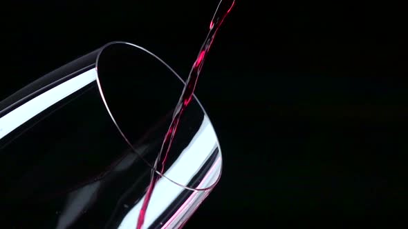 The Jet of Wine Being Poured Into a Glass, Black, Closeup, Slowmotion