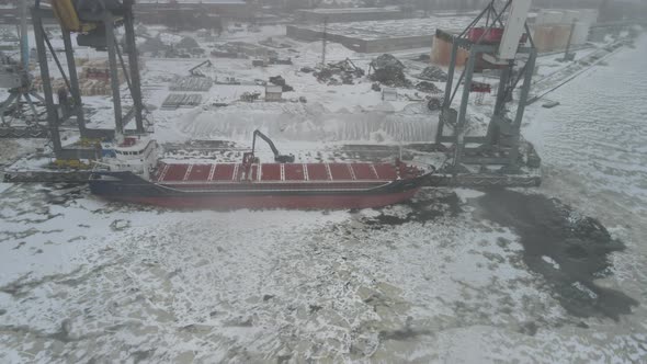 Winter port with cargo ship