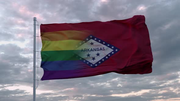 Waving Flag of Arkansas State and LGBT Rainbow Flag Background