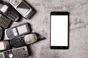 多くの時代遅れの携帯電話とグランジ背景のスマートフォン。 / Photodune, Misc