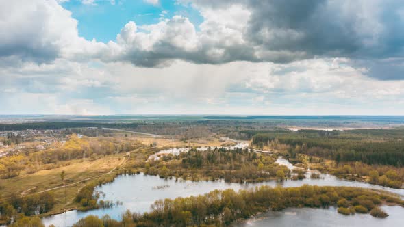 Timelapse Dronelapse Hyperlapse Aerial View Early Spring Forest Woods And Curved River