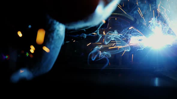 Welder welding a metal