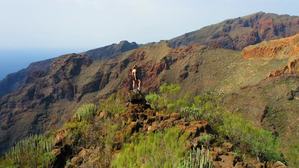 Young Woman Climbed the Peak of the Mountain