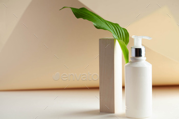 White cosmetic dispenser with space for your logo. Spa concept, skin care. Copy space. / Photodune, Misc