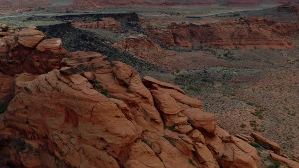 Aerial Drone footage of the mountainous red rocks in southern Utah. Showing the sky, the mountains,