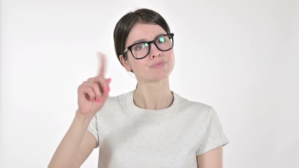 Young Woman Saying No with Finger on White Background