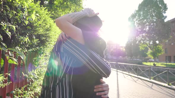 Couple meeting and hugging on the street