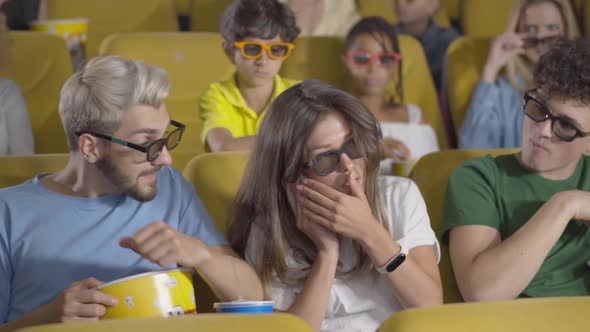 Beautiful Young Woman Picking Up Phone in Cinema Distracting People From Film, Portrait of Brunette