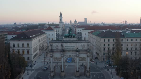 Siegestor in Munich Germany in Beautiful Sunset Dusk Scenic Cityscape with University in Background