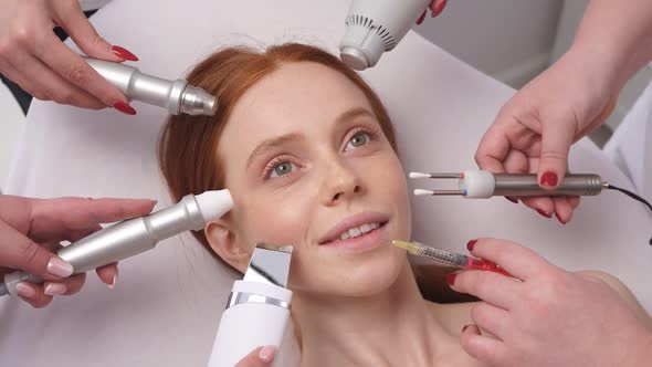 Conceptual Image of Beauty and Cosmetology Hands of Several Doctors Holding Cosmetic Devices