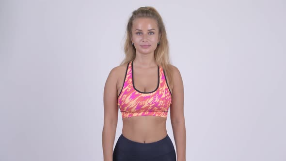 Happy Young Beautiful Blonde Woman Smiling Ready for Gym