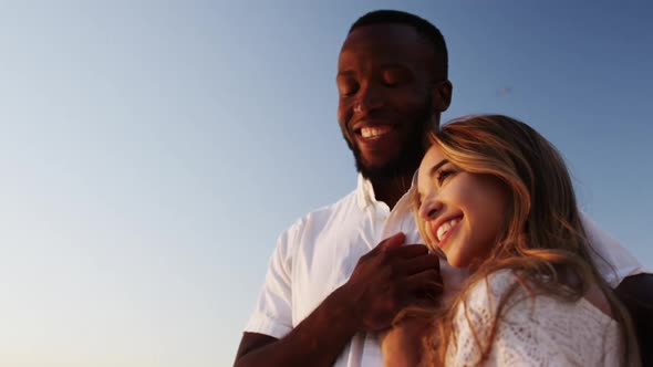 Couple embracing each other on the beach 4k