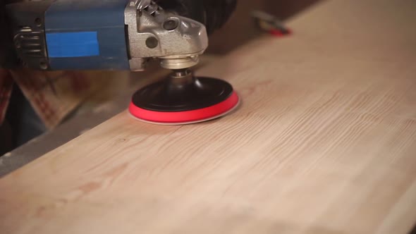 Buffing Works By Wood in a Workshop, Close-up of Electro Grinder