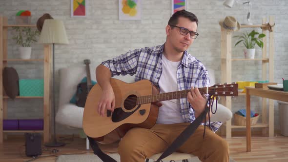 Young Musician Man Playing Guitar