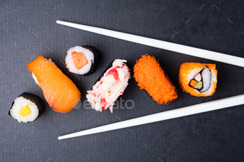 黒の背景に寿司セットと箸、日本食の上面図。 / Photodune, Misc
