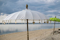 Traditionall white and green Balinese umbrellas on the beach of Gili Air - PhotoDune Item for Sale