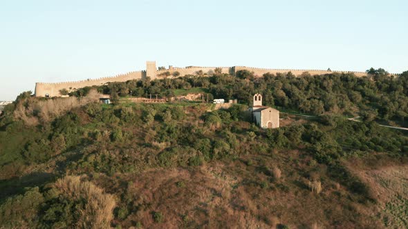 Revealing Shot Of Obidos Castle Behind Wall In Portugal With Ermida de Nossa Senhora do Carmo Chapel