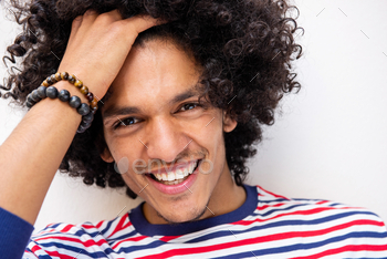 Close up smiling arabic male fashion model with hand in hair / Photodune, Misc