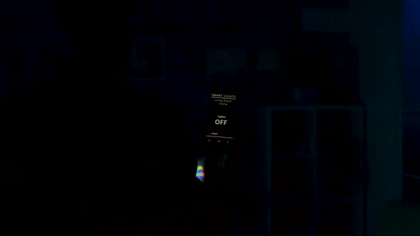 Man Uses Voice Activated Smart Lights App on His Smartphone To Tun on the Lights in the House