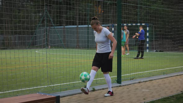 Portrait of Woman Football Soccer Player in Full Growth Woman in Professional Uniform Juggling with