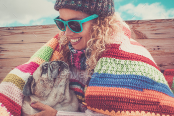 Happiness and tenderness with adult woman and pug dog together holding and embracing / Photodune, Misc