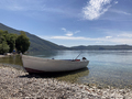 boat with motor on lake coast - PhotoDune Item for Sale