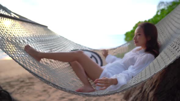 Asian woman enjoy around beautiful beach sea ocean