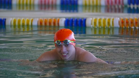 Asian Man Resting After Swimming