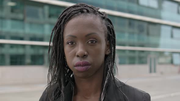 Attractive confident  black african business woman staring at camera